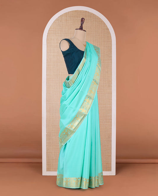 Green plain Mysore silk saree, two-headed eagle motifs zari border, and pallu