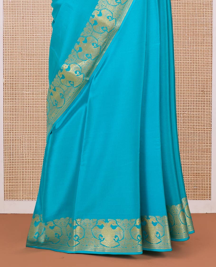 Blue plain Mysore silk saree, two-headed eagle motifs zari border, and pallu