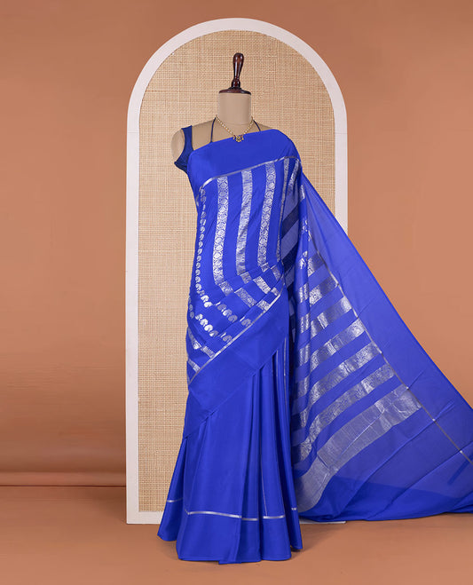 Blue floral creeper, peacock, elephant motifs woven Mysore silk saree, self-border, and traditional zari pallu