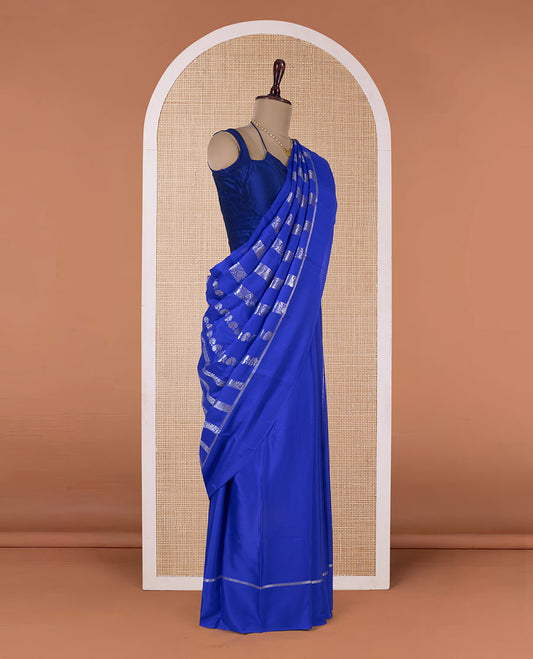 Blue floral creeper, peacock, elephant motifs woven Mysore silk saree, self-border, and traditional zari pallu