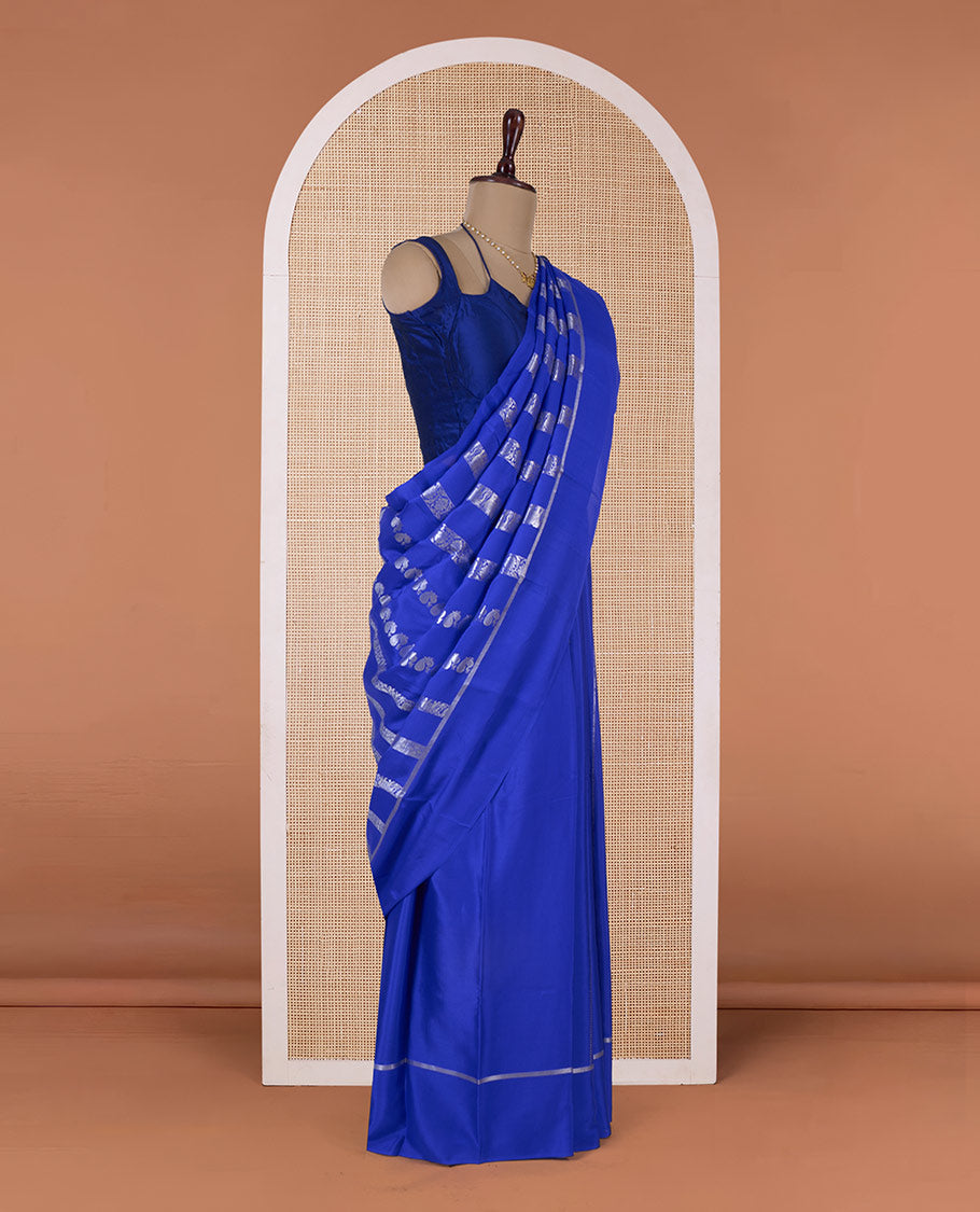 Blue floral creeper, peacock, elephant motifs woven Mysore silk saree, self-border, and traditional zari pallu