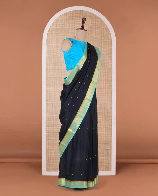 Black zari buttas Mysore silk saree, contrast floral creeper zari border, and pallu of zari buttas