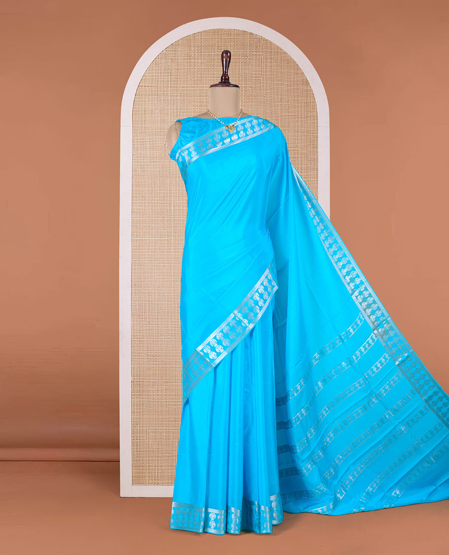 Blue plain Mysore silk saree, two-headed eagle zari woven border, and pallu of two-headed eagle motifs