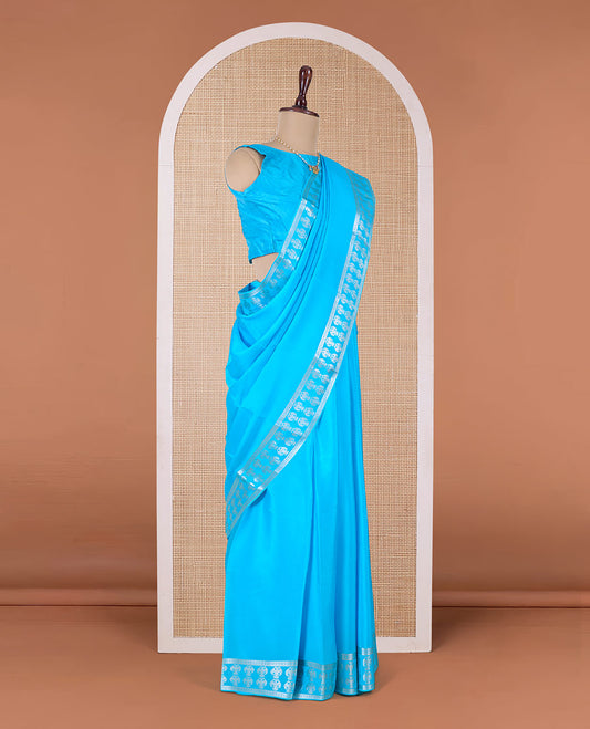 Blue plain Mysore silk saree, two-headed eagle zari woven border, and pallu of two-headed eagle motifs