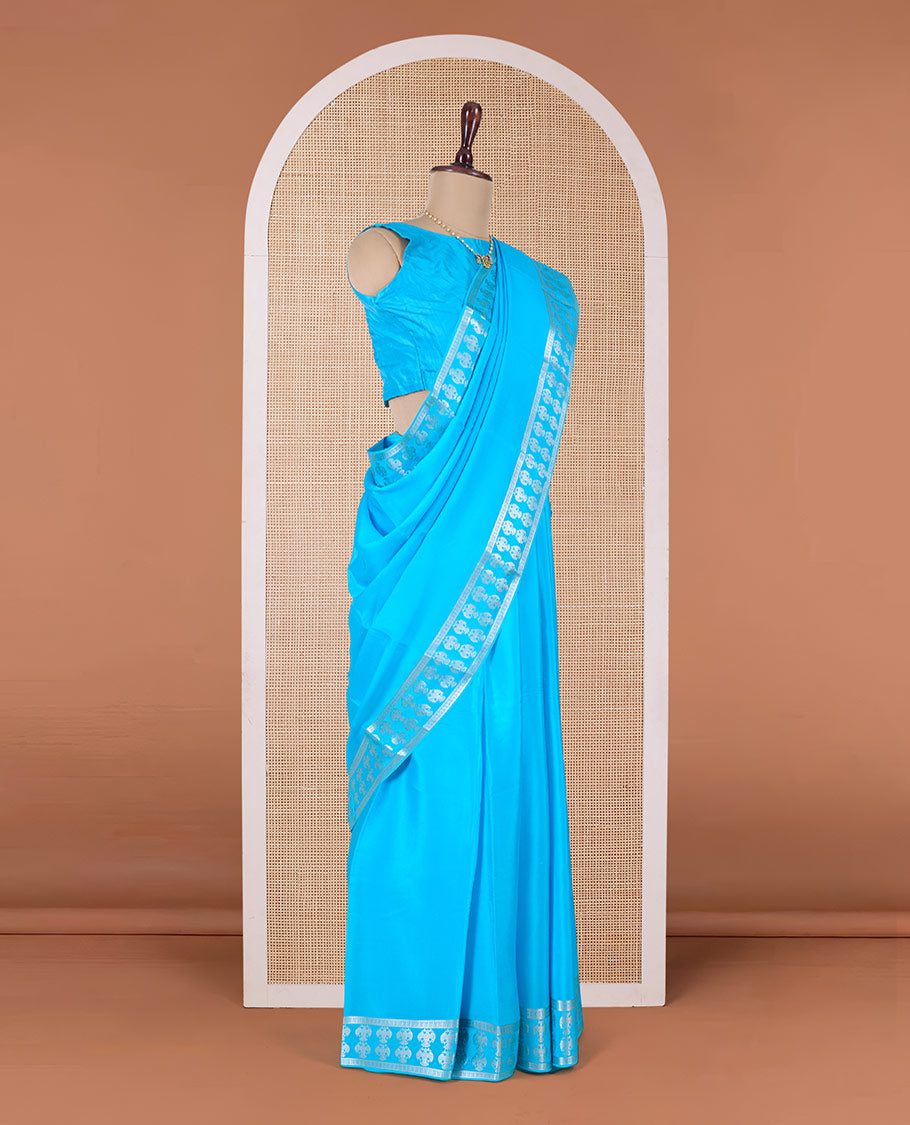 Blue plain Mysore silk saree, two-headed eagle zari woven border, and pallu of two-headed eagle motifs