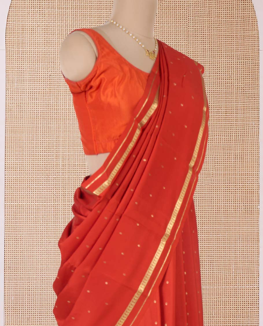 Orange zari buttas Mysore silk saree, paisley motifs border, and pallu of zari stripes