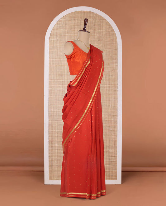 Orange zari buttas Mysore silk saree, paisley motifs border, and pallu of zari stripes