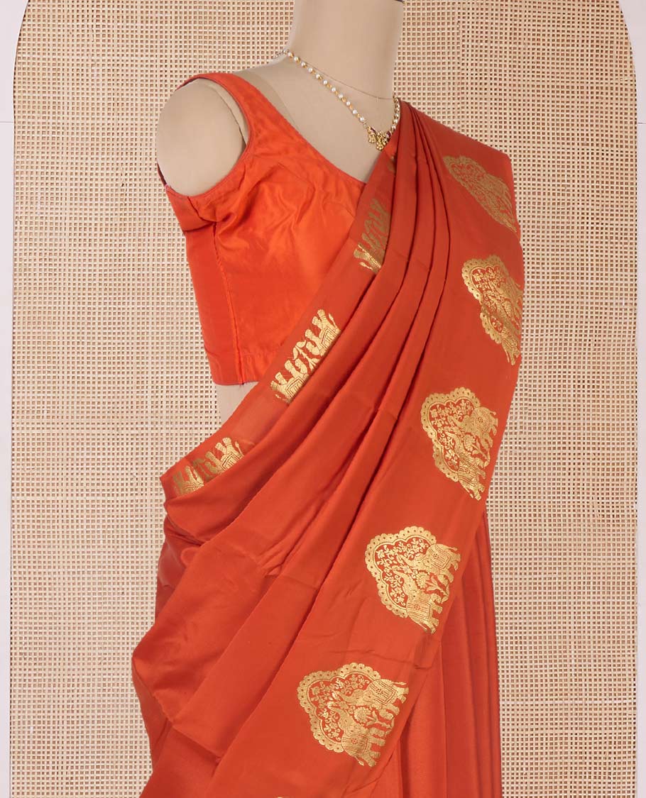 Orange plain Mysore silk saree, elephant motifs border, and pallu steeped with elephant motifs in zari