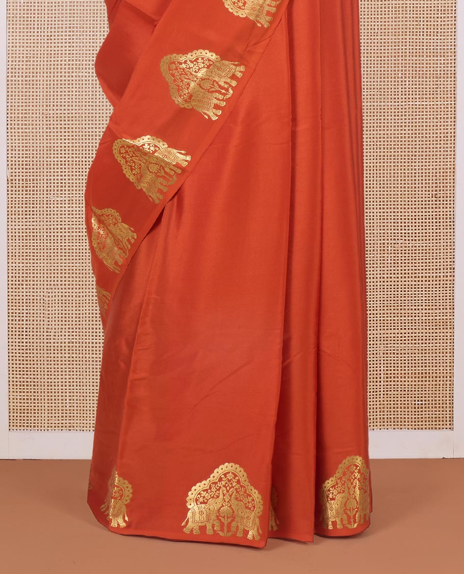 Orange plain Mysore silk saree, elephant motifs border, and pallu steeped with elephant motifs in zari