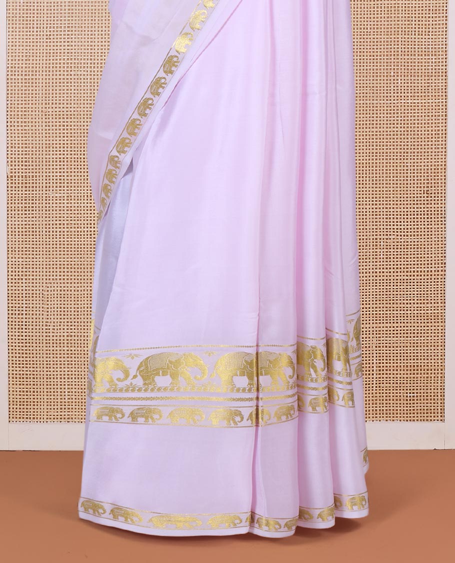 Baby pink plain Mysore silk saree, rettai pettu border of elephant motifs, and pallu of stripes in zari