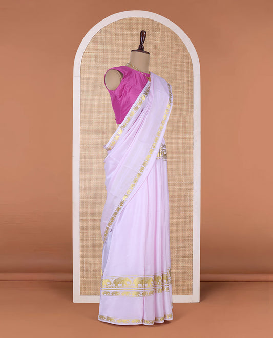 Baby pink plain Mysore silk saree, rettai pettu border of elephant motifs, and pallu of stripes in zari
