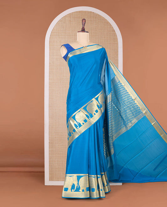 Blue plain Mysore silk saree, traditional zari border of elephant motifs in zari, and intricate pallu