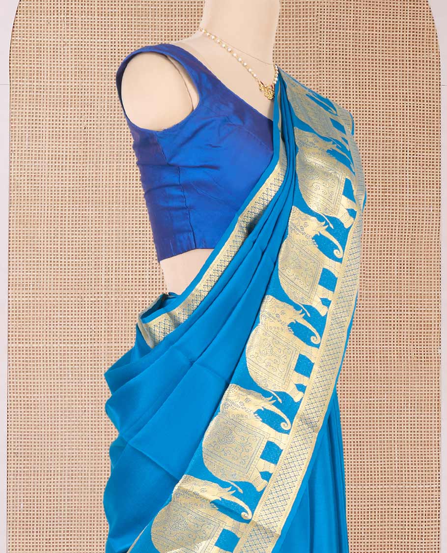 Blue plain Mysore silk saree, traditional zari border of elephant motifs in zari, and intricate pallu
