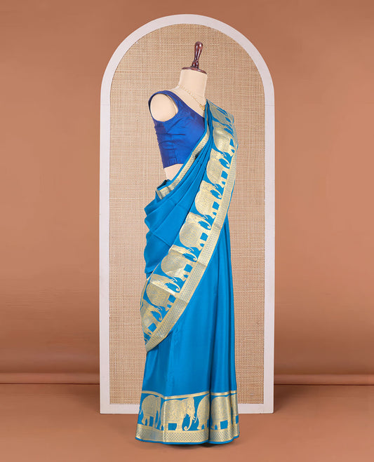 Blue plain Mysore silk saree, traditional zari border of elephant motifs in zari, and intricate pallu