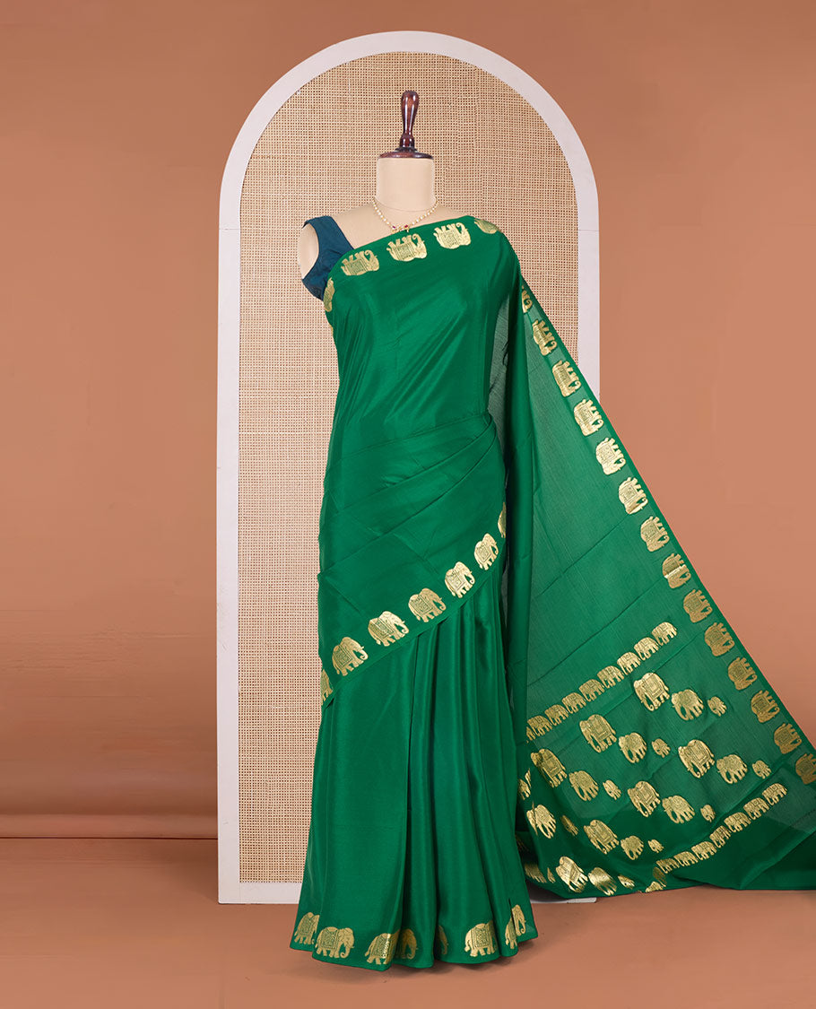 Green plain Mysore silk saree with elephant motifs zari border, and pallu of miniatures of elephant motifs
