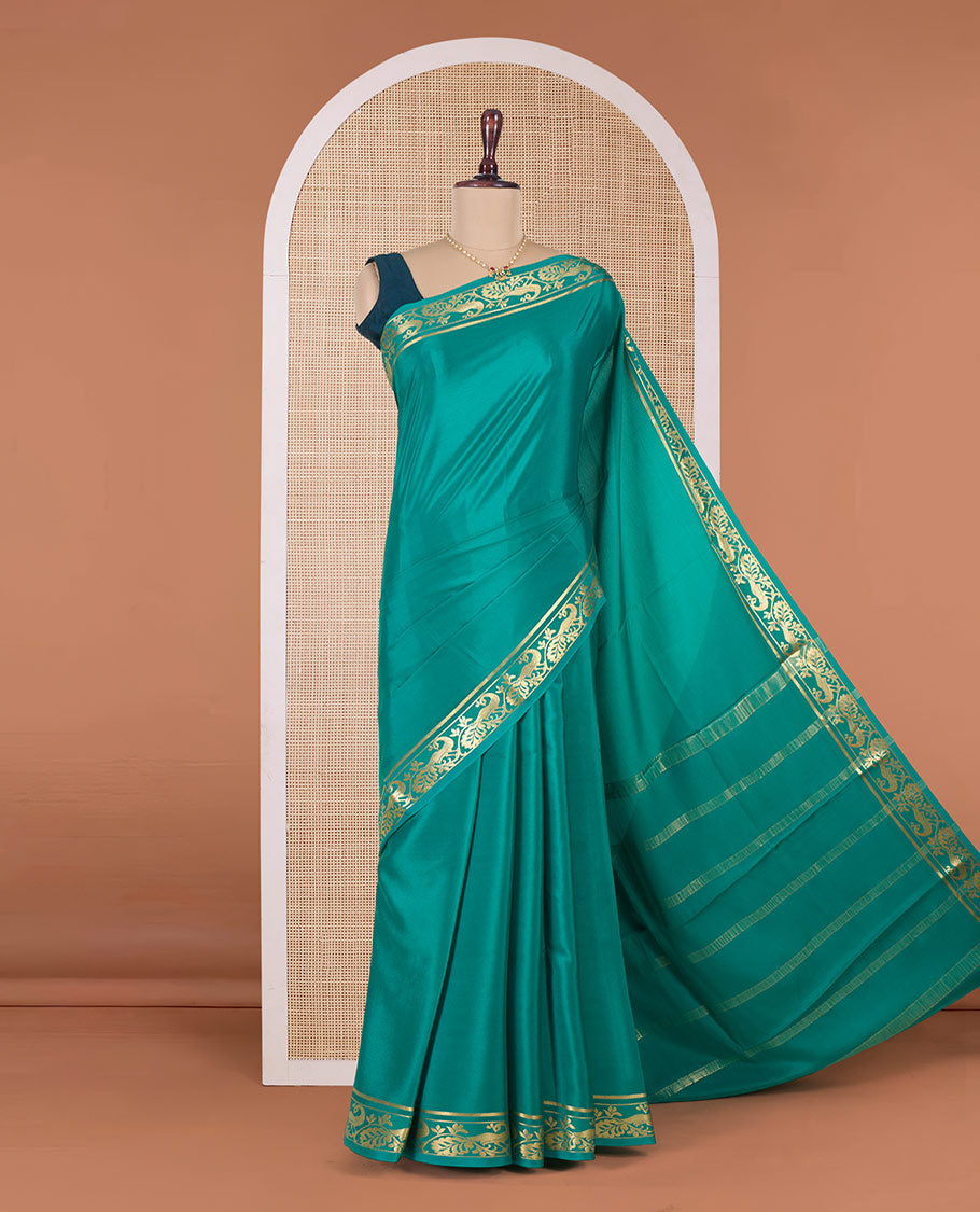 Green plain Mysore silk saree, peacock motifs zari border l, and zari striped pallu