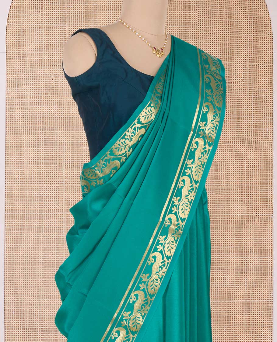 Green plain Mysore silk saree, peacock motifs zari border l, and zari striped pallu