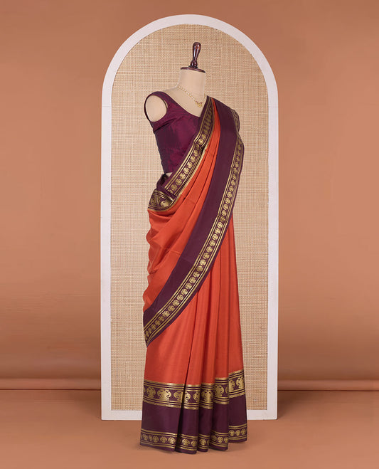 Orange plain Mysore silk saree, contrast traditional zari border, and pallu of zari stripes