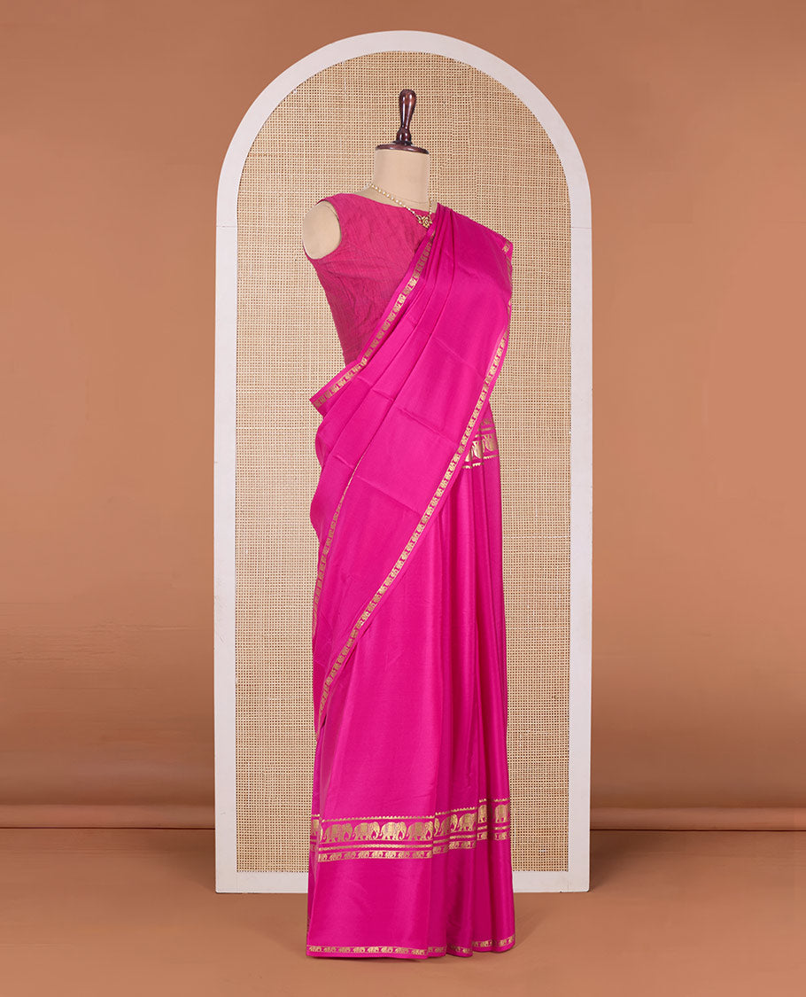Pink plain Mysore silk saree, traditional zari border of elephant motifs, and zari striped pallu