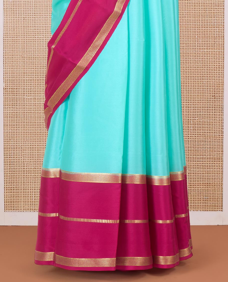 Turquoise plain Mysore silk saree, contrast traditional zari border, and zari-rich pallu