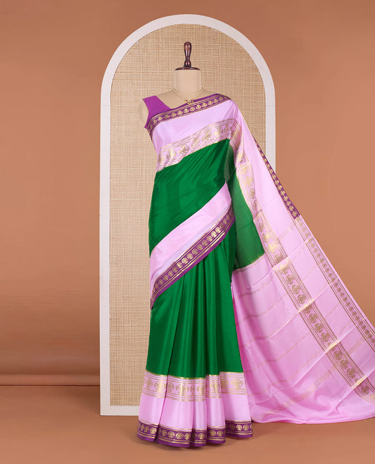 Green plain Mysore silk saree, contrast traditional zari border, and pallu of zari stripes