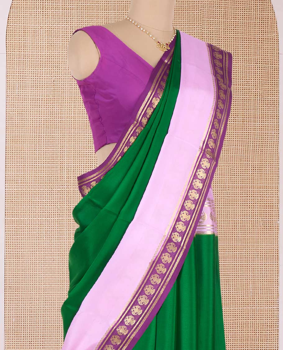 Green plain Mysore silk saree, contrast traditional zari border, and pallu of zari stripes