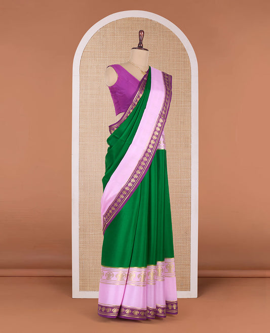 Green plain Mysore silk saree, contrast traditional zari border, and pallu of zari stripes