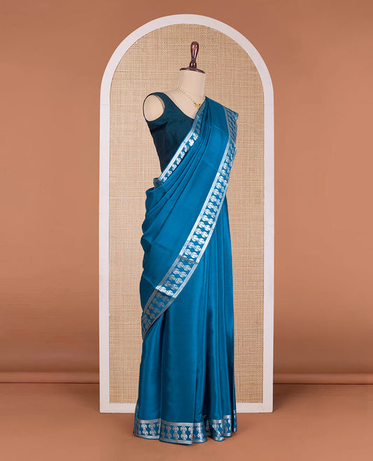 Blue plain Mysore silk saree, zari border of two-headed eagle motifs, pallu steeped with two-headed eagle motifs