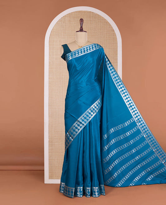 Blue plain Mysore silk saree, zari border of two-headed eagle motifs, pallu steeped with two-headed eagle motifs