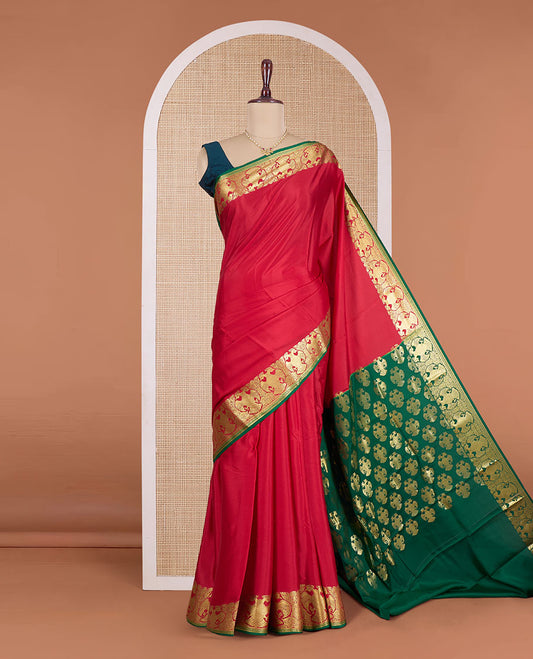 Red plain Mysore silk saree, contrast zari border of two-headed eagle motifs, and pallu steeped with two-headed eagle motifs