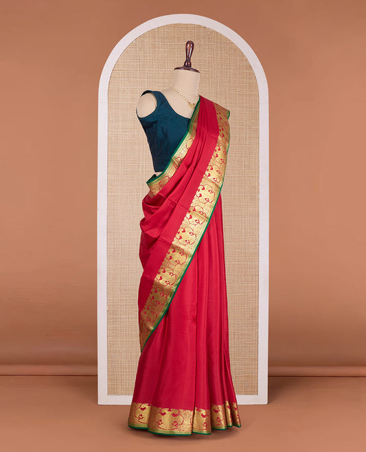 Red plain Mysore silk saree, contrast zari border of two-headed eagle motifs, and pallu steeped with two-headed eagle motifs