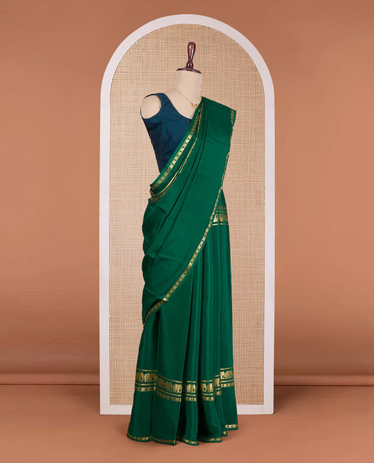 Green plain Mysore silk saree, rettai pettu traditional zari border of elephant motifs, and zari striped pallu