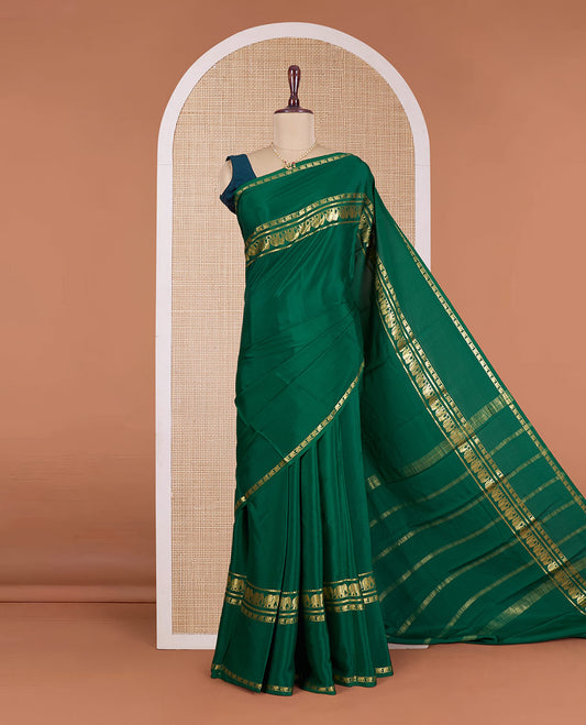 Green plain Mysore silk saree, rettai pettu traditional zari border of elephant motifs, and zari striped pallu