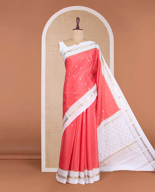 Orange paisley buttas Mysore silk saree, contrast traditional zari border of peacock designs, and pallu of paisleys