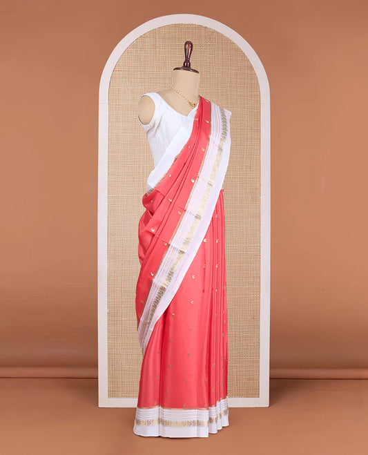 Orange paisley buttas Mysore silk saree, contrast traditional zari border of peacock designs, and pallu of paisleys