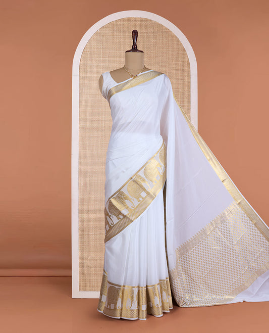 Cream plain Mysore silk saree, traditional zari border of elephant motifs, and pallu steeped with manga designs