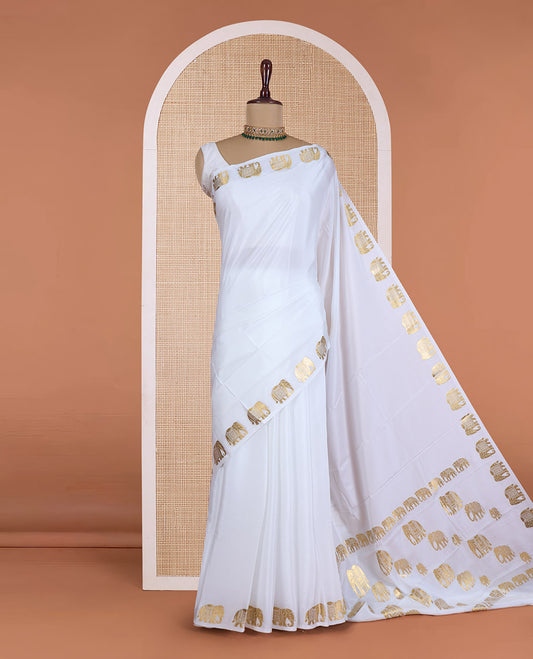 Cream plain Mysore silk saree, zari border of elephant motifs, and pallu steeped with elephant motifs