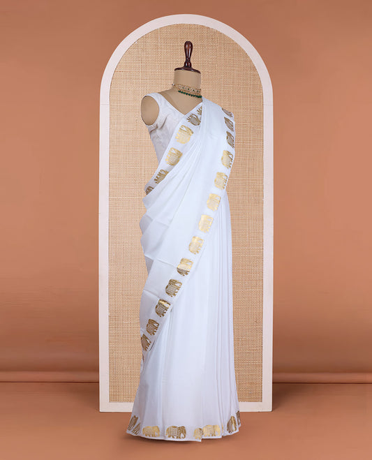 Cream plain Mysore silk saree, zari border of elephant motifs, and pallu steeped with elephant motifs