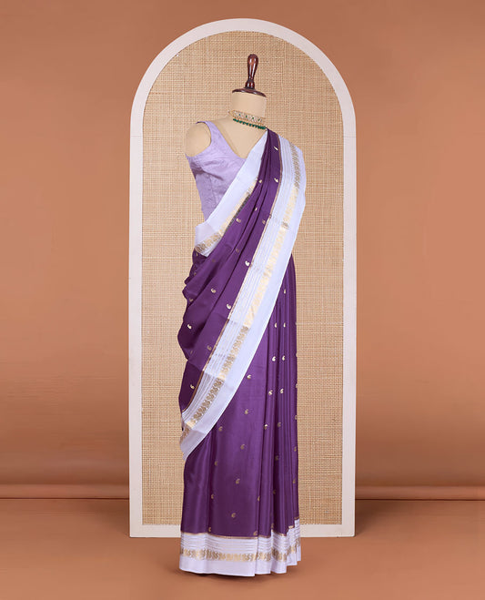 Purple manga buttas Mysore silk saree, contrast border of traditional zari designs, and pallu steeped with manga motifs