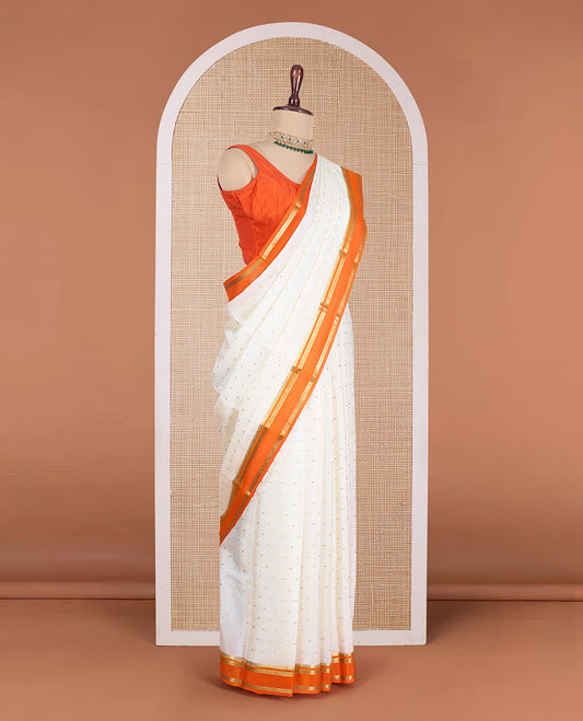 Cream zari buttas Mysore silk saree, contrast traditional zari rettai pettu border, and zari striped pallu