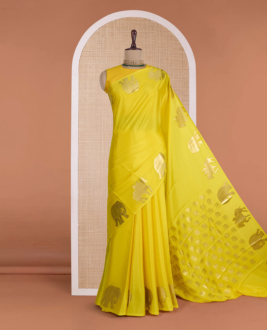 Yellow plain Mysore silk saree, zari border of elephant and kuthirai motifs, and pallu of minature animal motifs