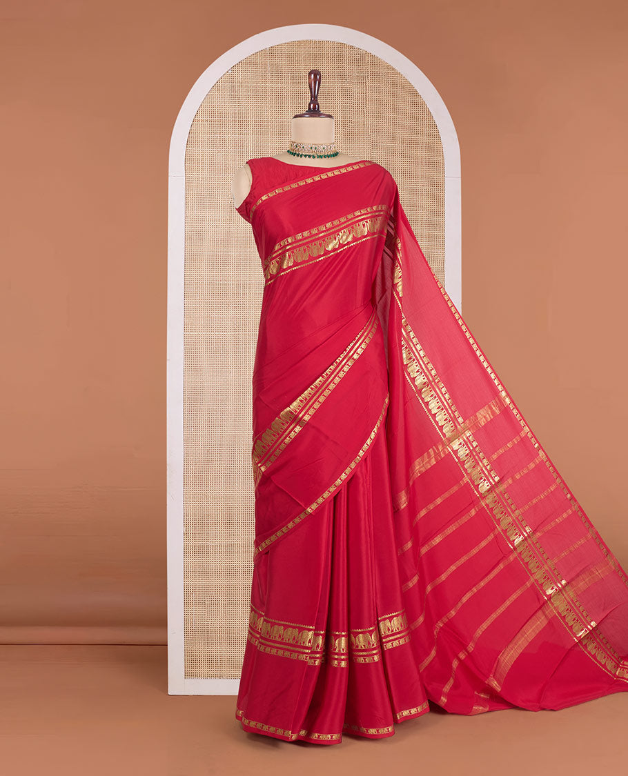 Red plain Mysore silk saree, zari border of elephant motifs, and zari striped pallu