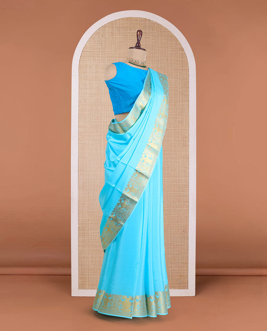 Blue plain Mysore silk saree, zari border of two-headed eagle motifs, and pallu steeped with two-headed eagle motifs