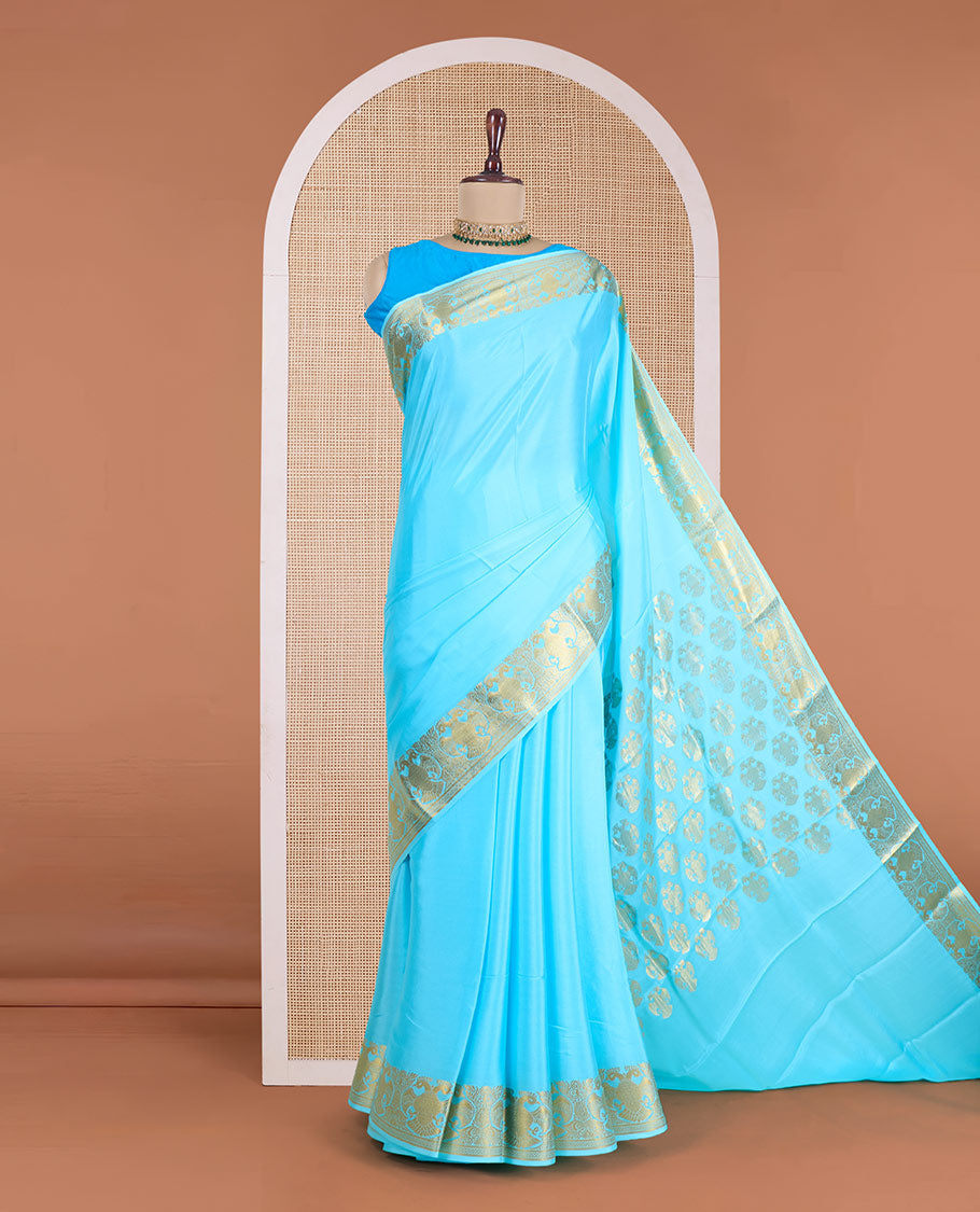 Blue plain Mysore silk saree, zari border of two-headed eagle motifs, and pallu steeped with two-headed eagle motifs