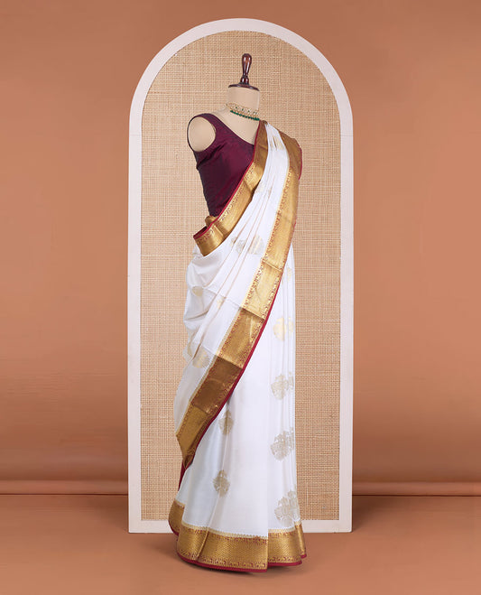 Cream two-headed eagle motifs Mysore silk saree, contrast traditional zari design border, and zari design pallu
