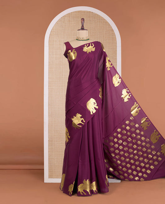 Maroon plain Mysore silk saree, zari border of elephant and kuthirai motifs, and pallu of minature animal motifs
