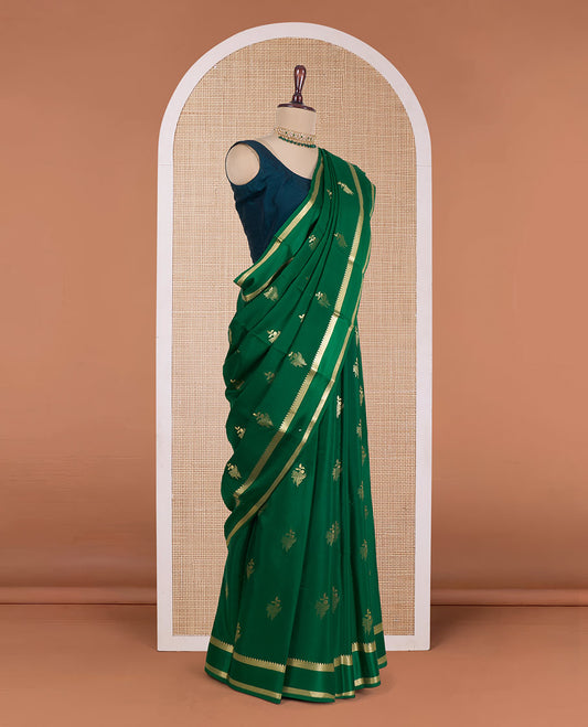 Green zari buttas Mysore silk saree, rettai pettu temple zari border, and zari-rich jaal pallu
