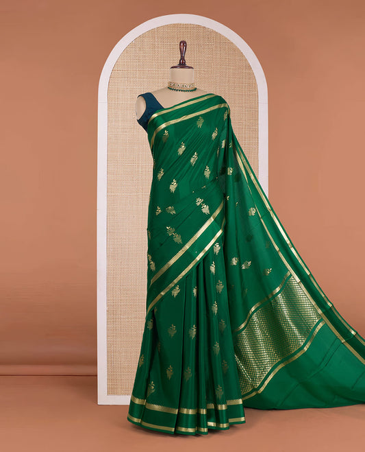 Green zari buttas Mysore silk saree, rettai pettu temple zari border, and zari-rich jaal pallu
