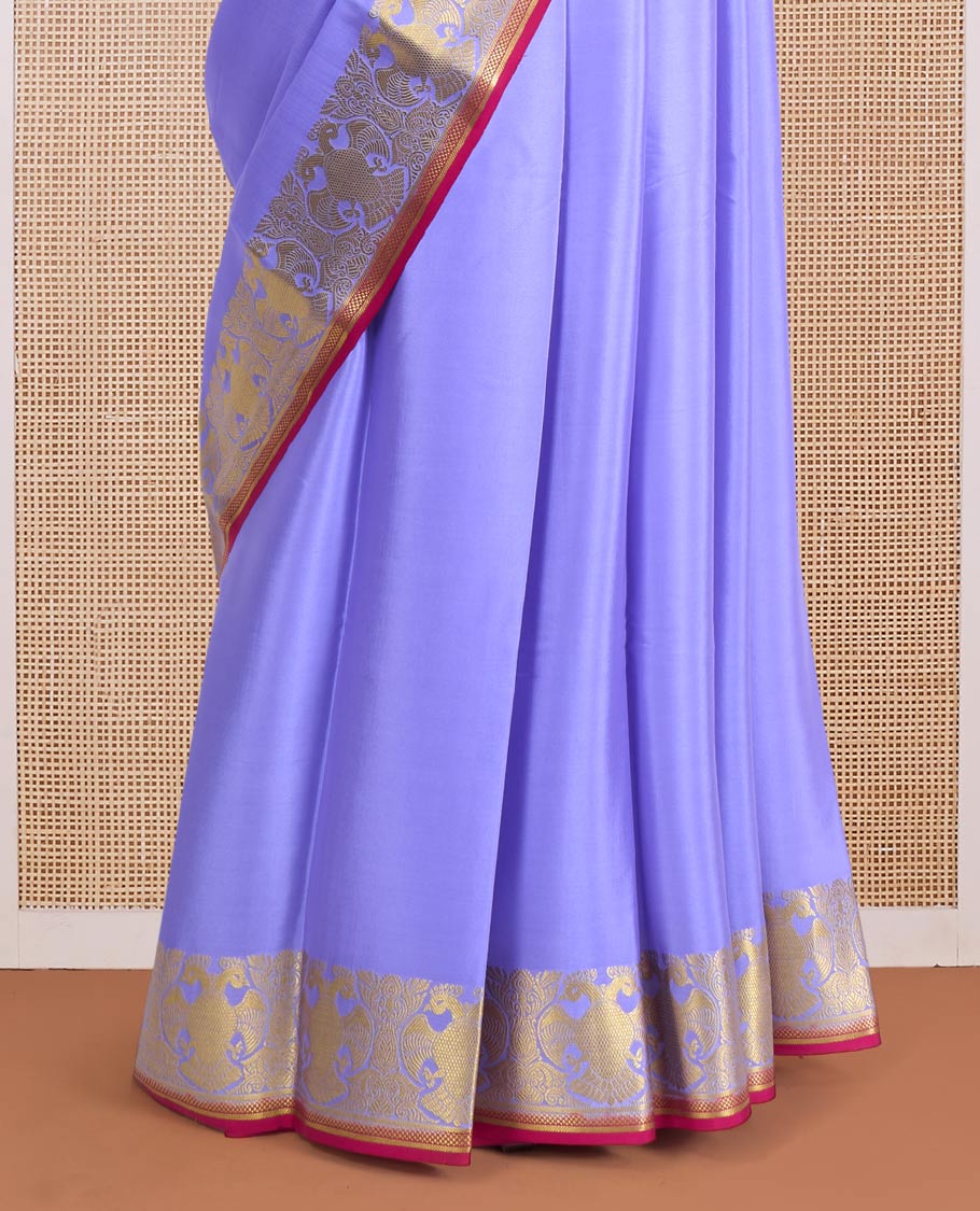 Violet plain Mysore silk saree, zari border of two-headed eagle motifs, and contrast pallu steeped with two-headed eagle motifs