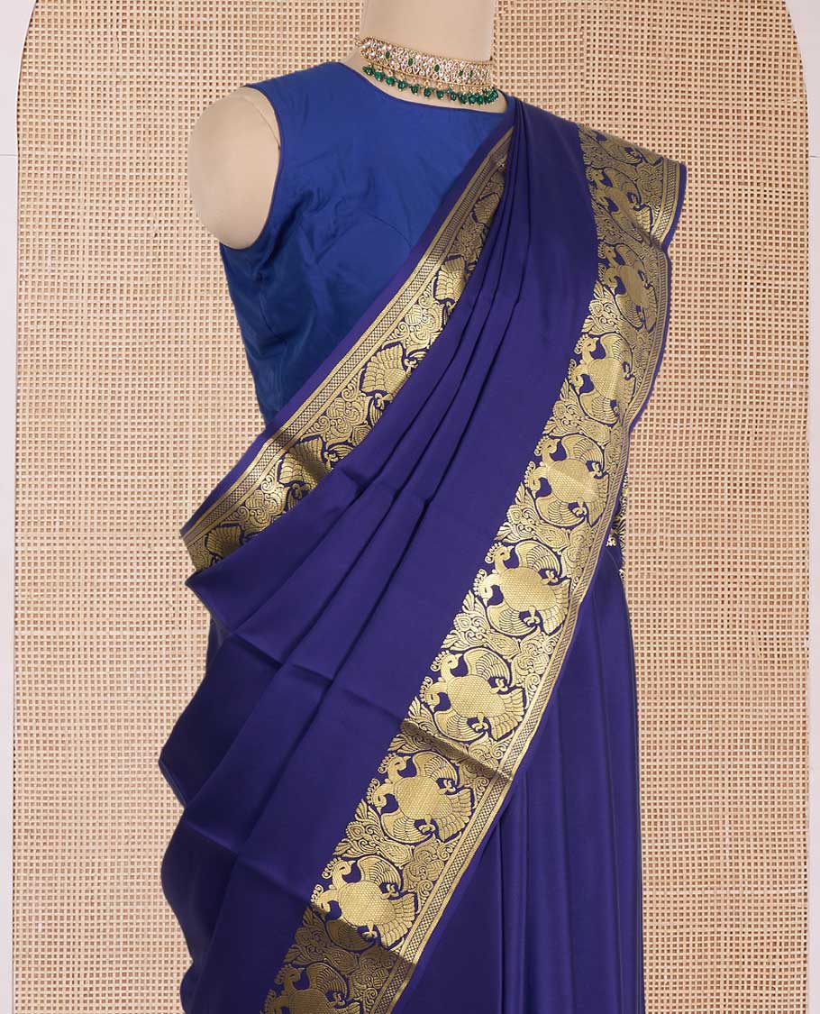 Navy blue plain Mysore silk saree, zari border of two-headed eagle motifs, and pallu steeepd with two-headed eagle motifs